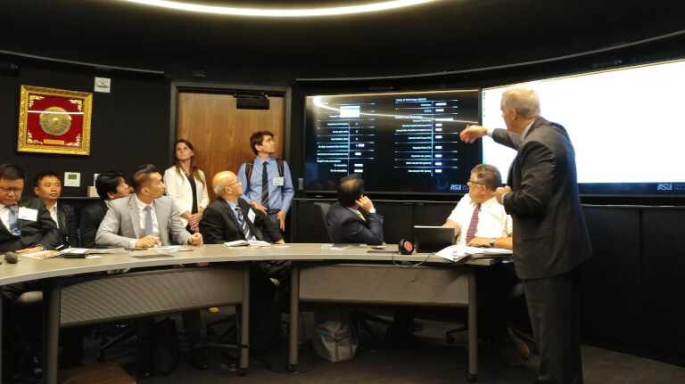 Group of men and woman at Smar Cities Symposium ASU Decision Theater 